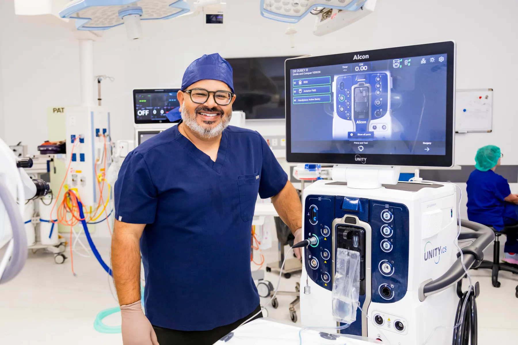 Dr Rahul Dubey beside advanced vitreoretinal equipment